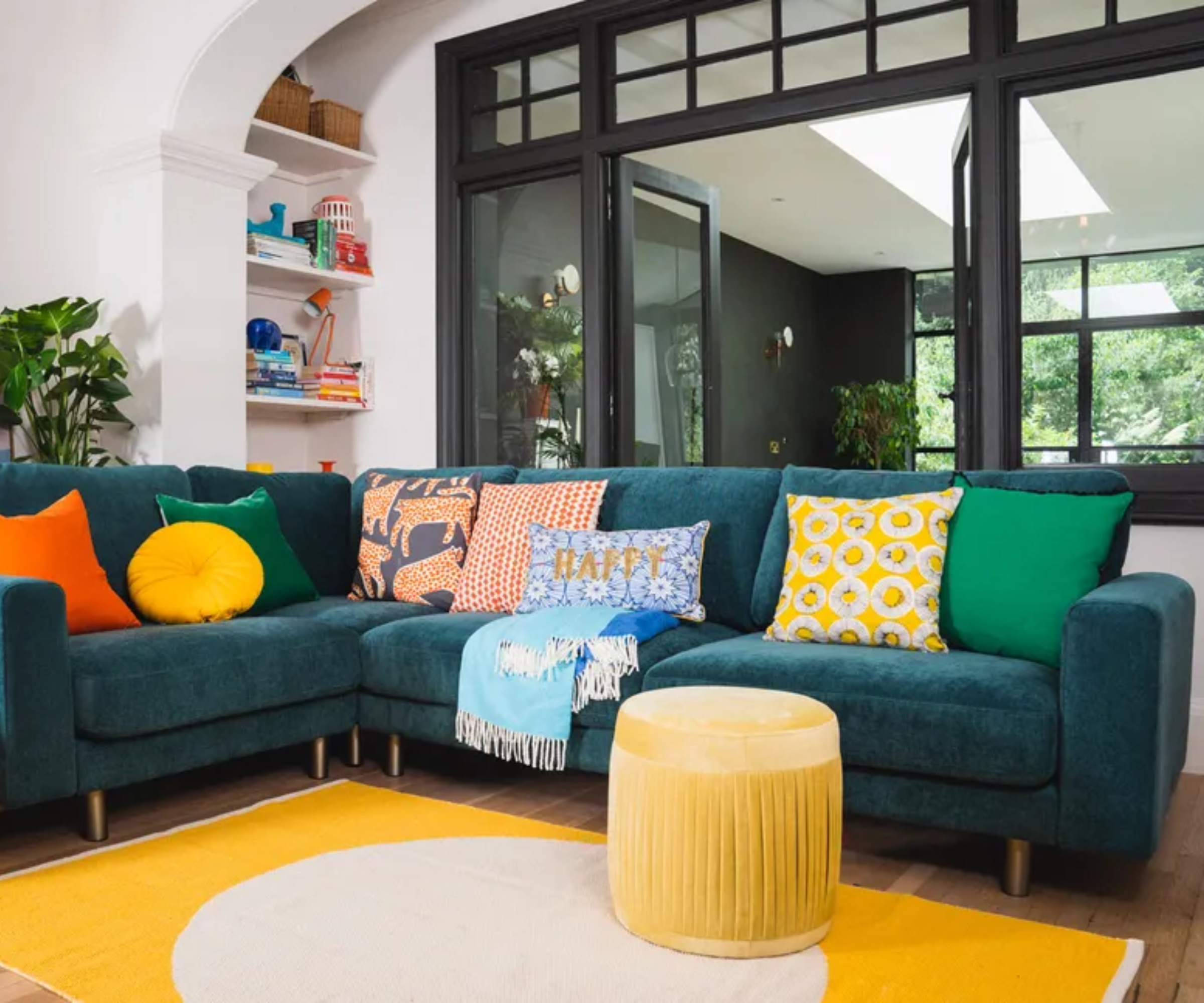 Living room with glass doors behind the sofa
