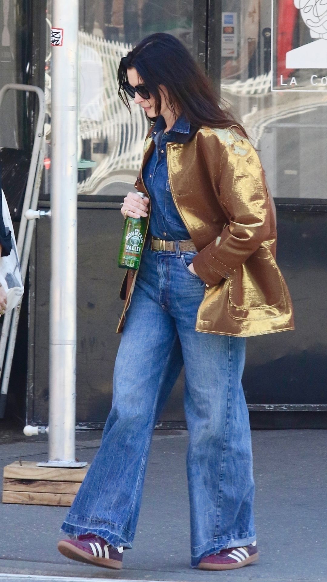 Anne Hathaway wears metallic jacket and jeans during stroll in Downtown NYC 28/04/2025