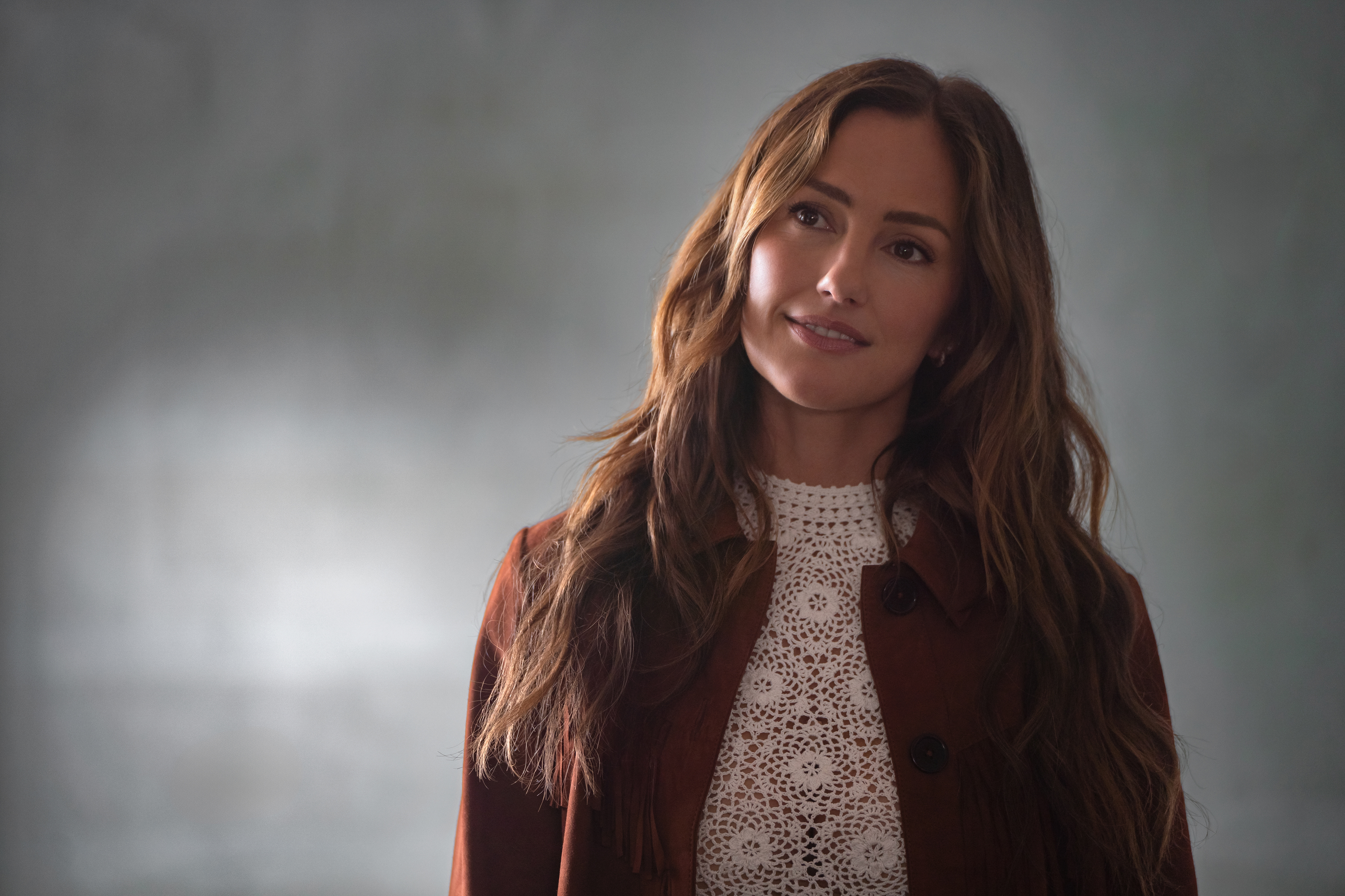 Minka Kelly as Quinn, wearing a brown jacket and white lace blouse, in Episode 208 of Netflix's 'Ransom Canyon' season 2.