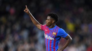 Ansu Fati celebrates scoring a goal for Barcelona.