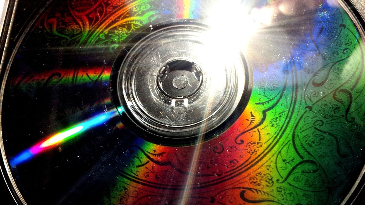 Burning imagery onto a CD's data surface