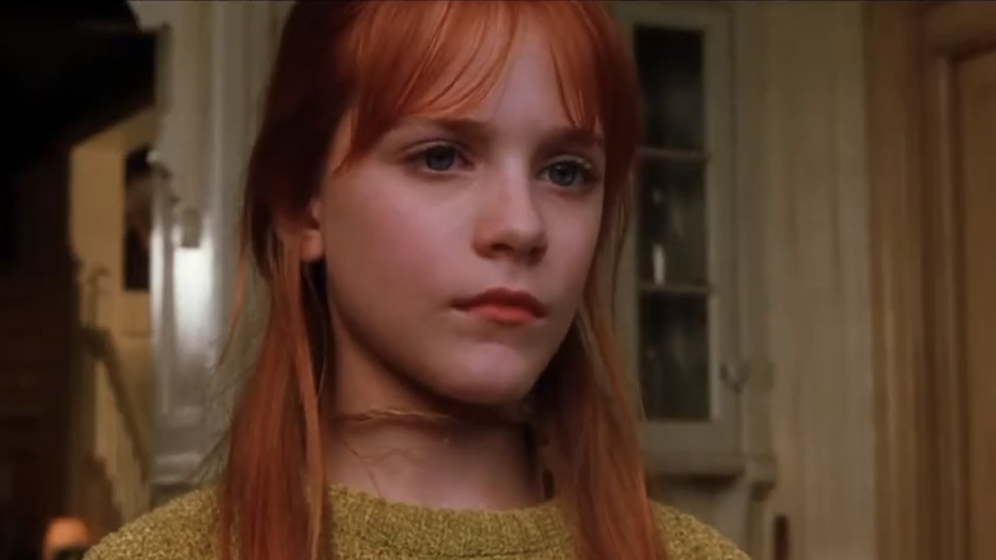 Evan Rachel Wood looking out the window in Practical Magic. 