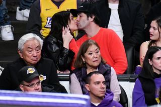 Ashley Benson and Brandon Davis attend a basketball game between the Los Angeles Lakers and the Houston Rockets