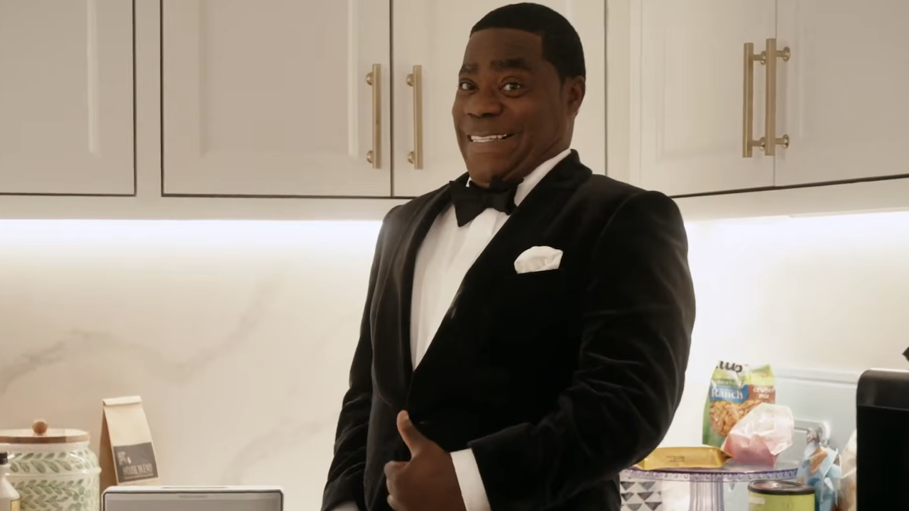 Reggie in tuxedo giving the camera a thumbs up in The Fall and Rise of Reggie Dinkins Season 1