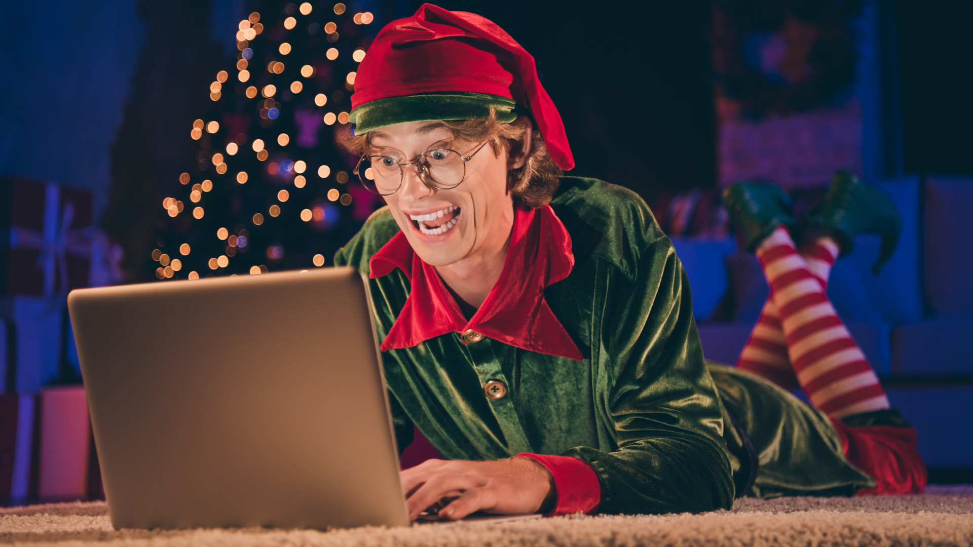 A very excited elf using a laptop