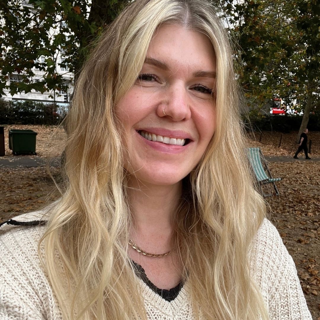 beauty editor Fiona McKim in a cream knitted top testing MD London The Numbers Hair products