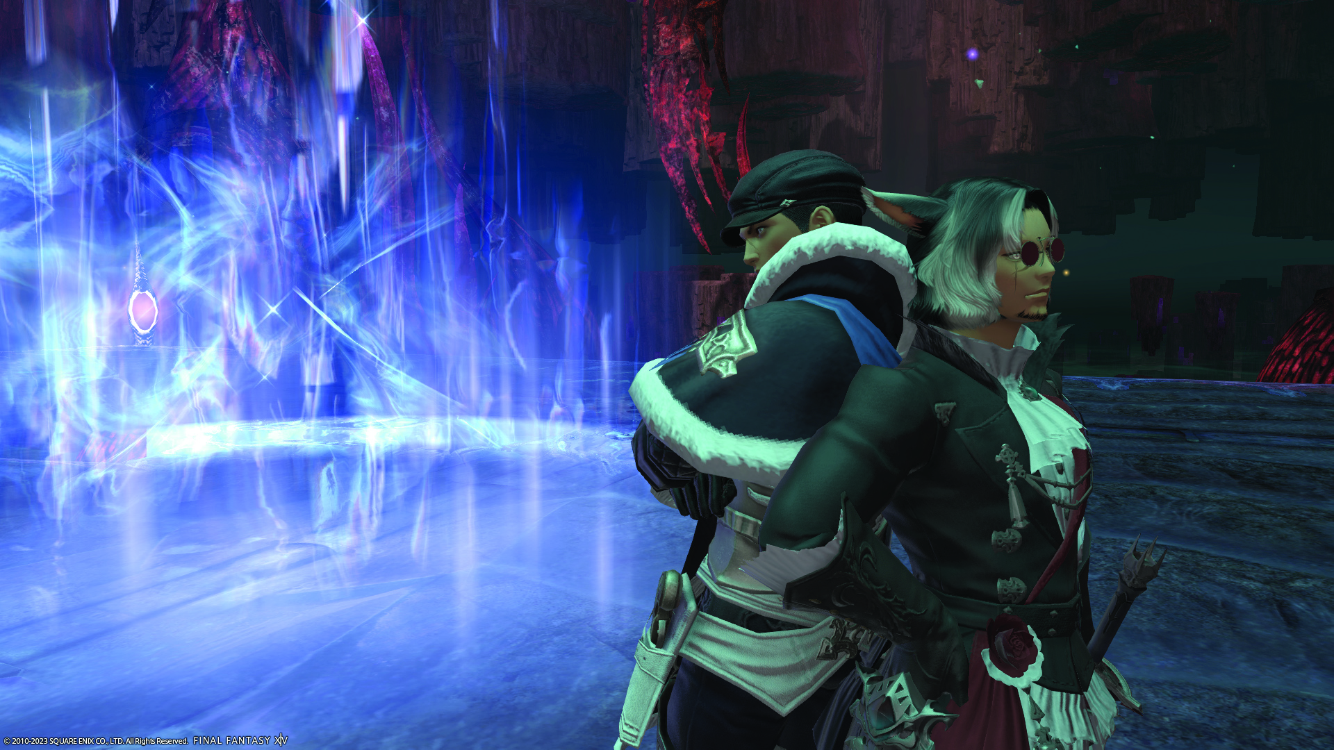 Two fancy looking FF14 characters standing back to back next to a magical blue aura.