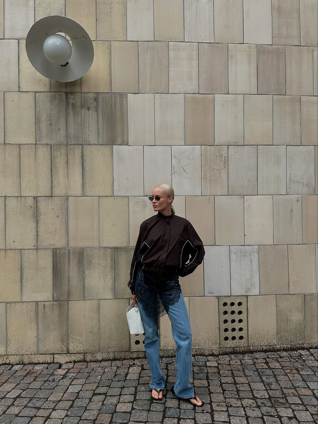 Woman wearing bootcut jeans with heeled sandals.