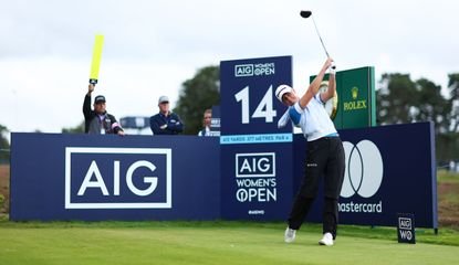 Charley Hull tees off in front of an AIG board