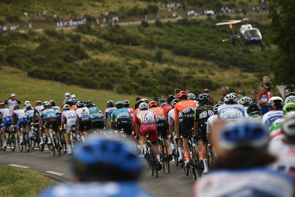 The pack rides during the 13th stage of the 107th edition of the Tour de France cycling race 191 km between ChatelGuyon and Puy Mary on September 11 2020 Photo by Marco Bertorello AFP Photo by MARCO BERTORELLOAFP via Getty Images