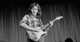 Rory Gallagher live onstage with a Strat, 1973