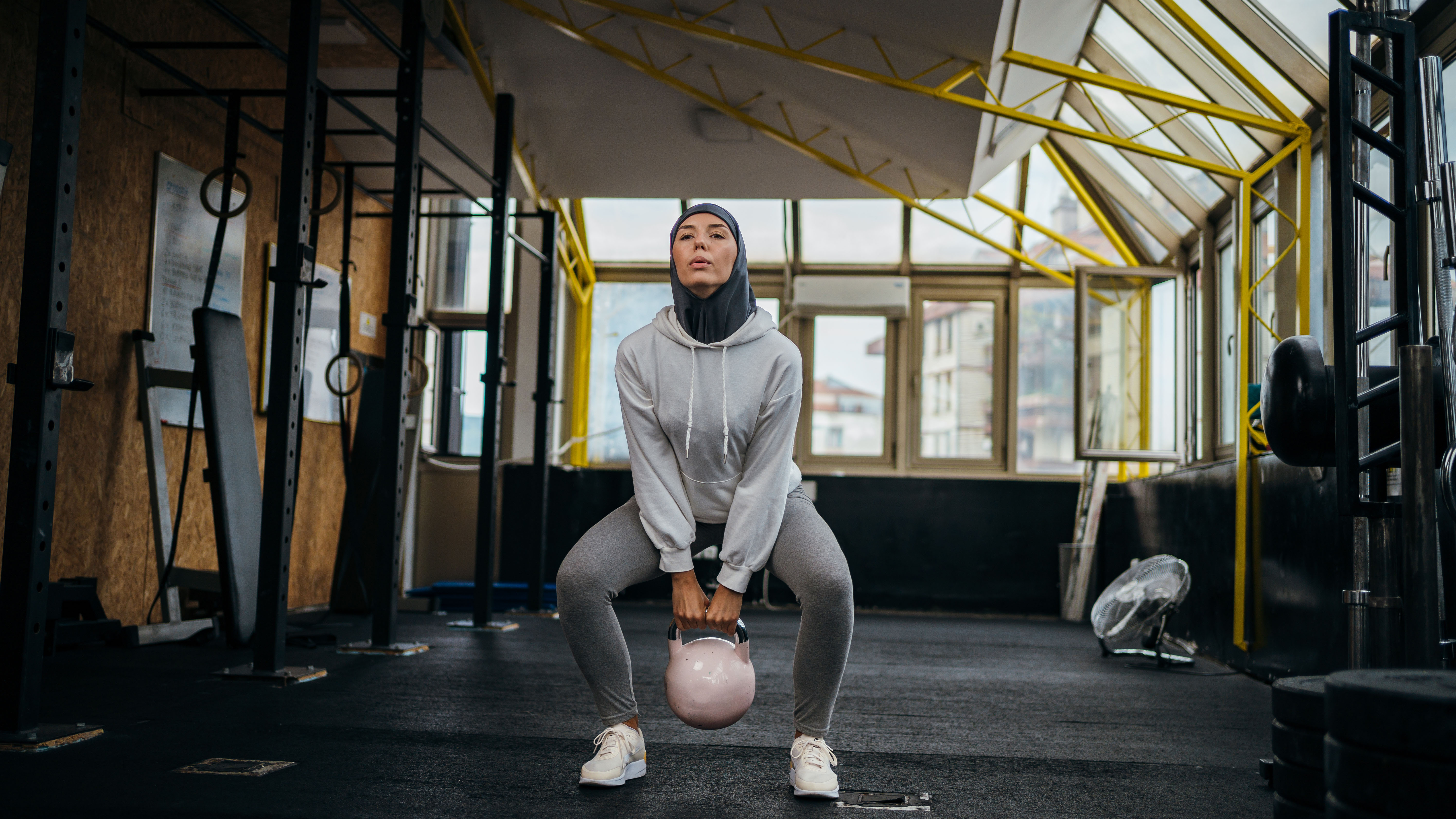 Muslim woman exercising in gym