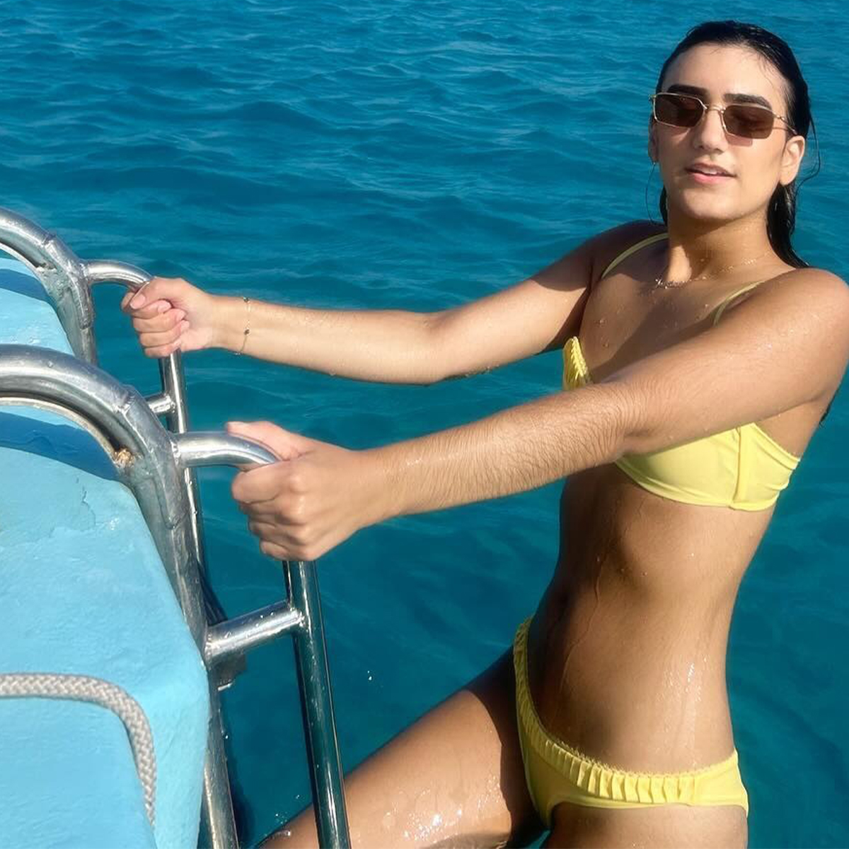 WWW editor Josephine Hadjiloucas wearing a yellow bikini