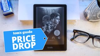 Amazon Kindle Paperwhite shown next to a pair of glasses