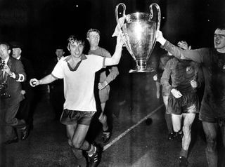 George Best and his Manchester United team-mates celebrate with the European Cup after victory over Benfica in the final in 1968.