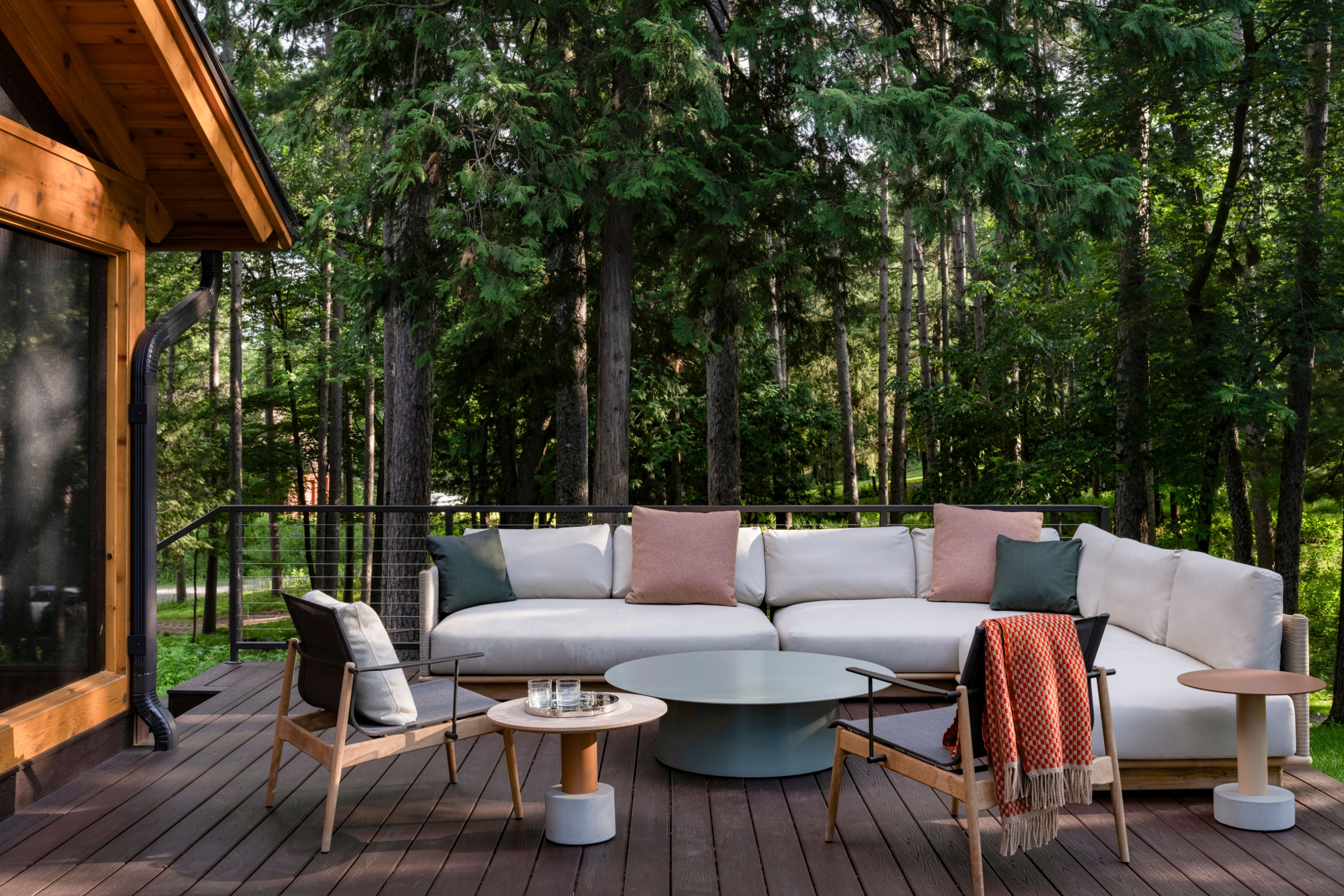 outdoor living room with wooden outdoor furniture and corner sofa