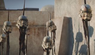 Storm trooper helmets on spikes in The Mandalorian