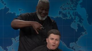 Colin Jost looks concerned as he's about to get his head shaved live on SNL.