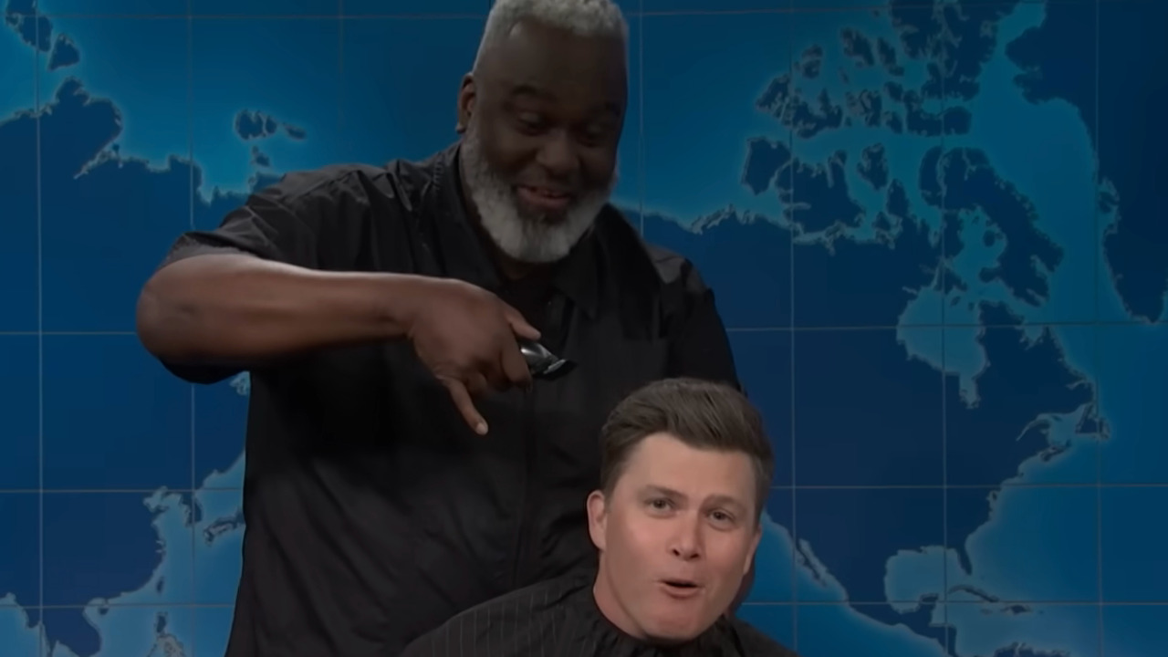 Colin Jost looks concerned as he's about to get his head shaved live on SNL.