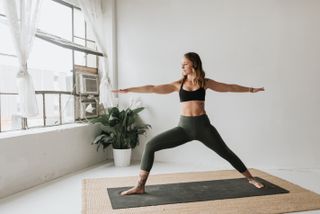 Vaginal care: Woman practising yoga in studio