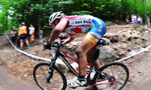 A H&amp;R Block rider cornering.