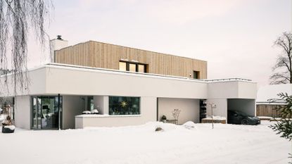 A home with a garage and car parked outside 