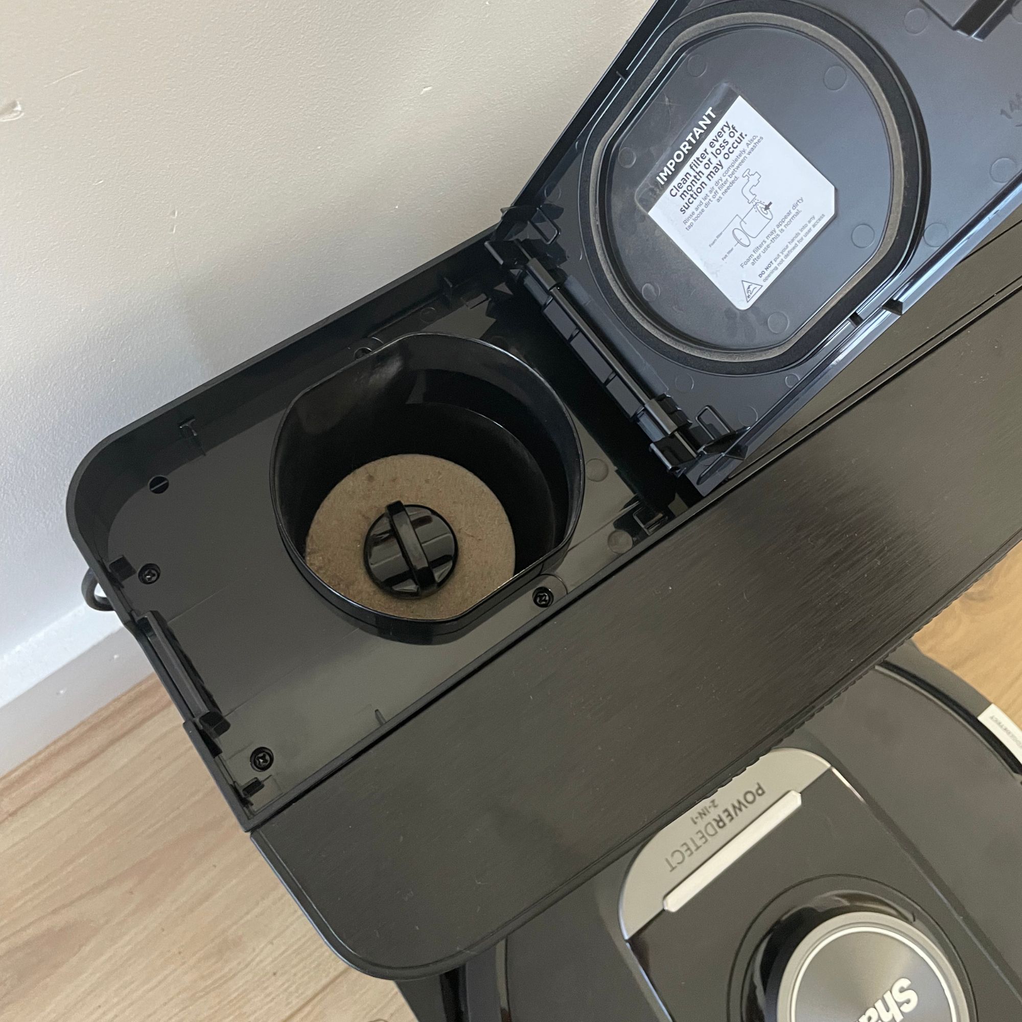 Open filter compartment of the Shark PowerDetect NeverTouch Robot Vacuum and Mop