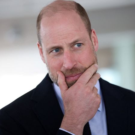 Prince William putting his hand on his chin 