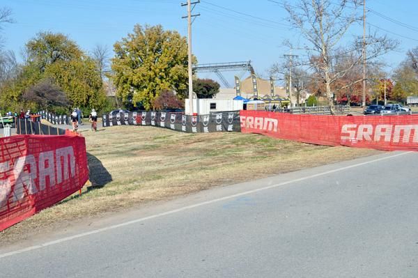 After the peloton flies down the opening stretch of pavement on River Road, they'll turn left onto the grass and into Eva Bandman Park.
