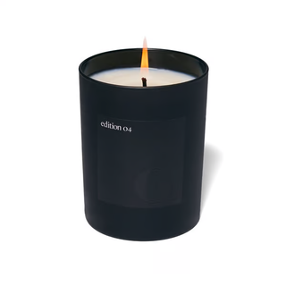 Candle in black vessel