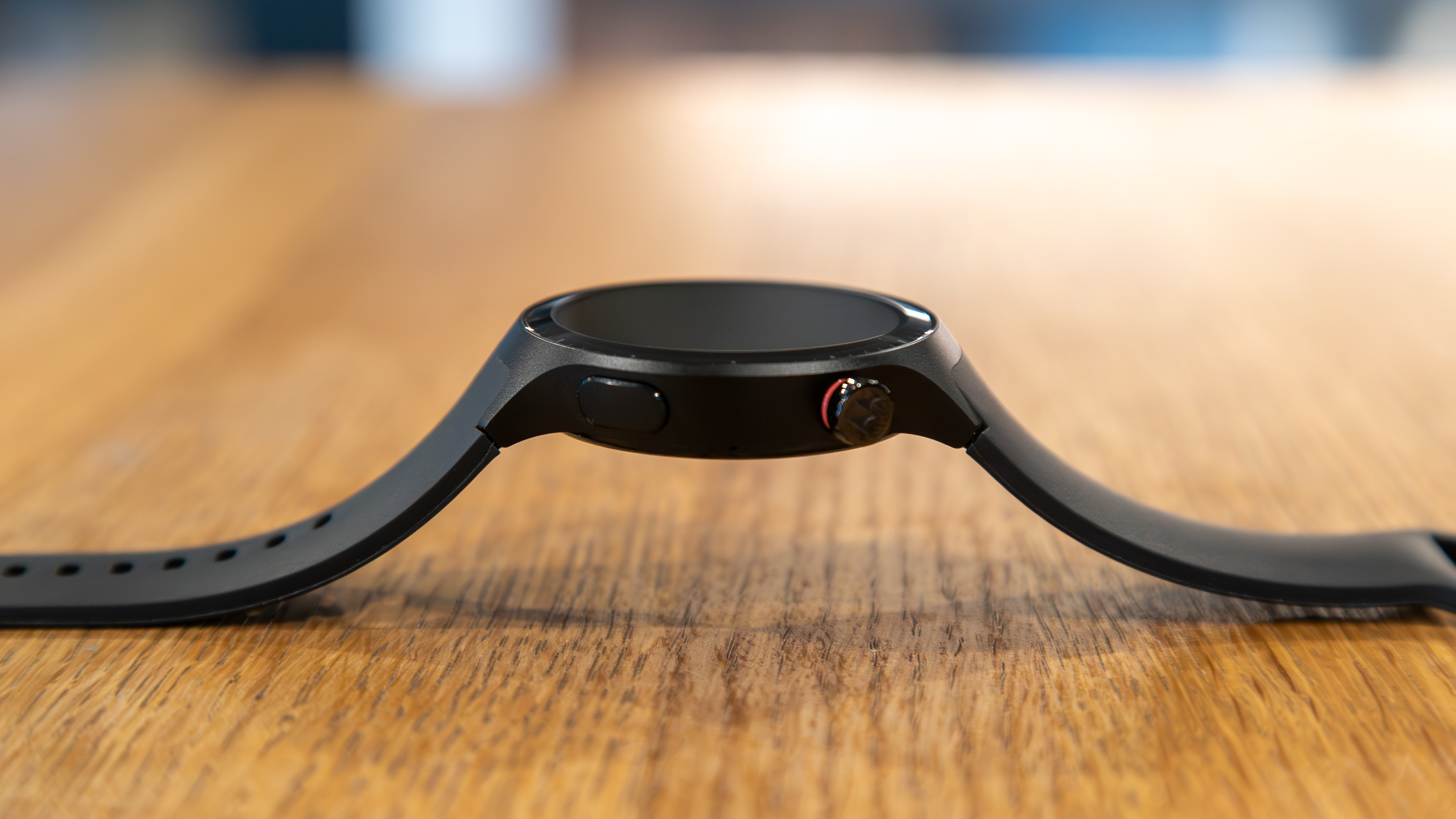 The Moto Watch from the side on a table