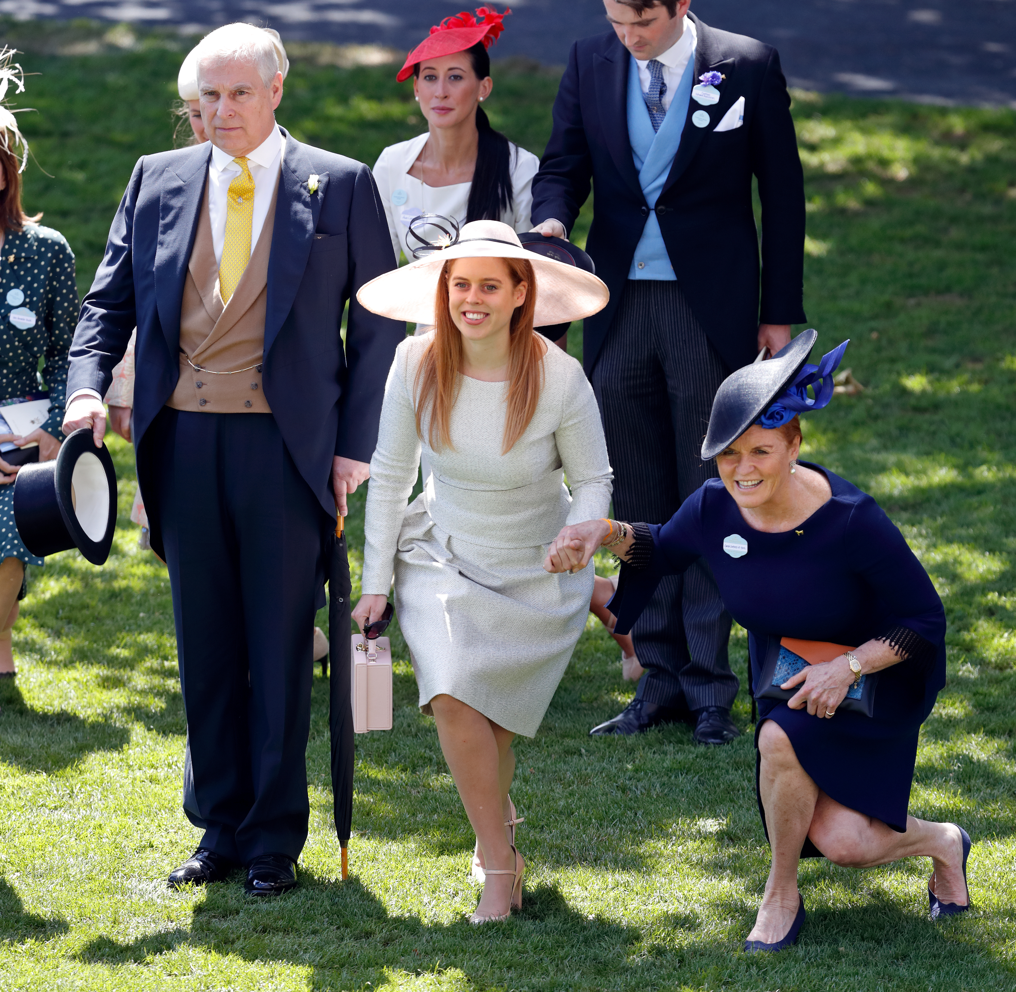 Prince Andrew, Sarah Ferguson and Princess Beatrice curtseying at Royal Ascot