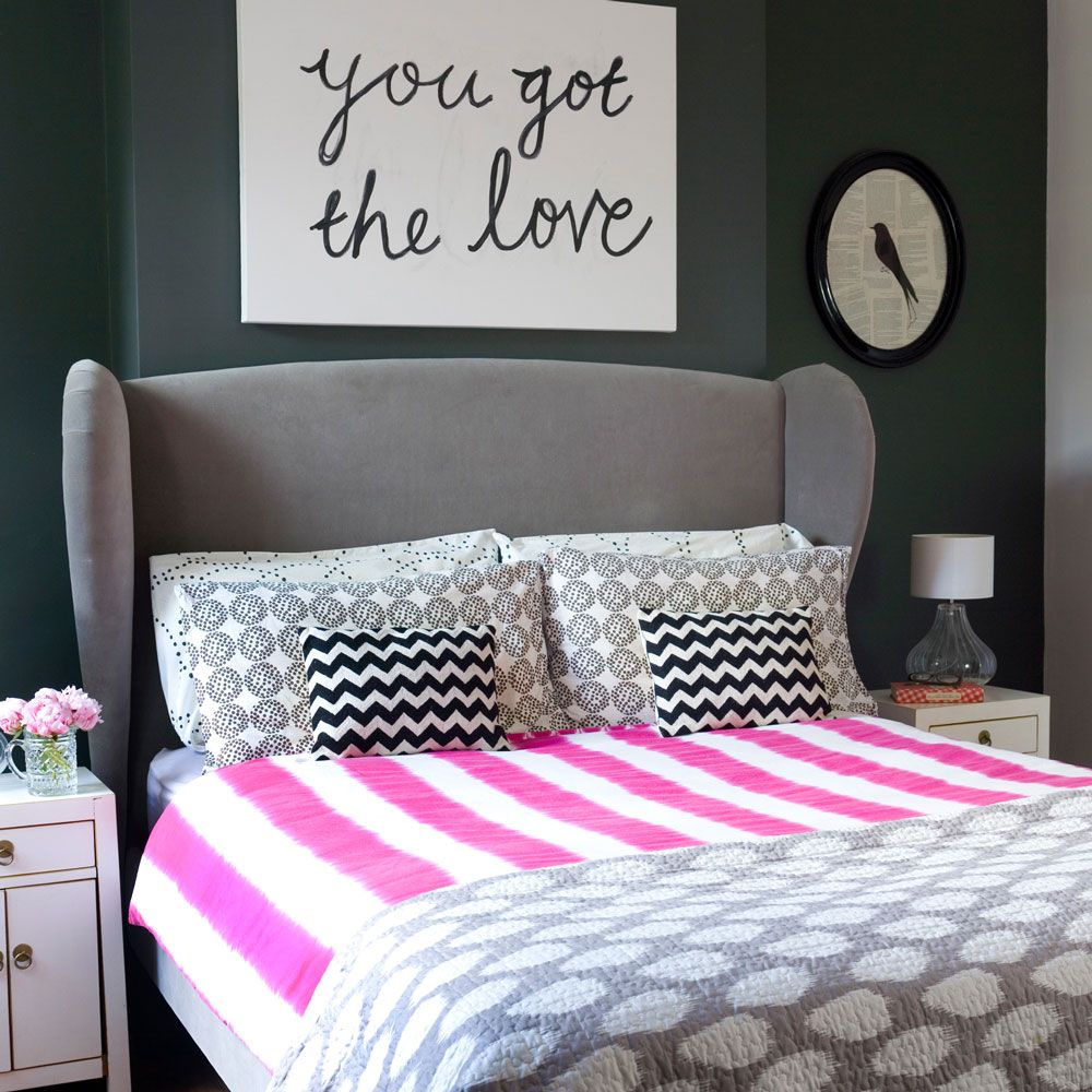 grey bedroom with grey upholstered headboard