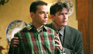 Two and a Half Men Jon Cryer and Charlie Sheen stand together
