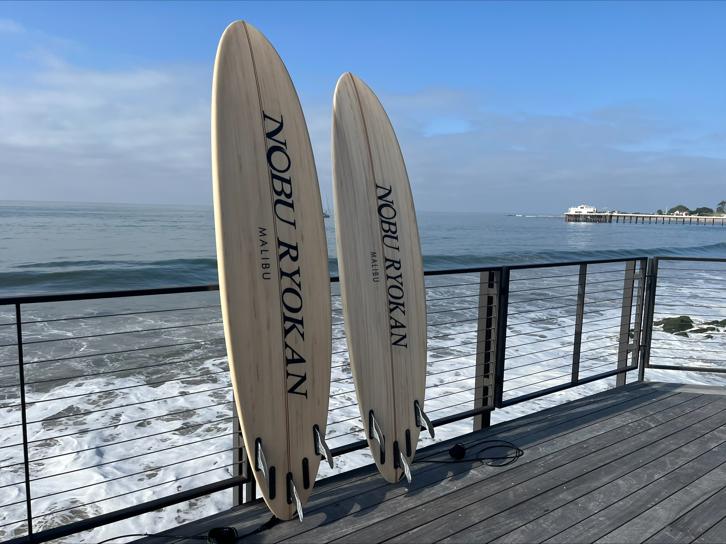 Surfboards leaned against a balcony at Nobu Ryokan Malibu