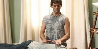 James Marsden as Barry massaging someone in Modern Family.