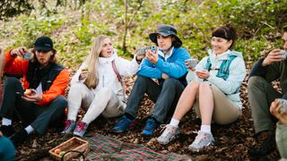 Young people sitting in a circle in nature