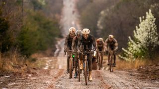 Riders in the mud at Mid South gravel race