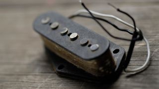 A single coil pickup lying on a workbench