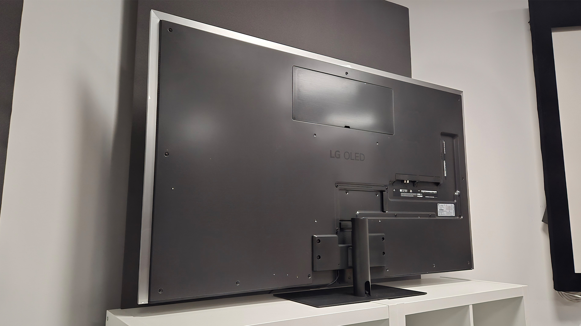 LG G6 (OLED65G6) OLED TV, rear of TV set in test room on white wooden shelving unit