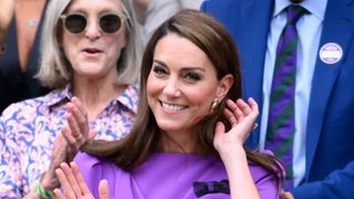 Catherine, Princess of Wales waves on Centre Court during the men's final on day fourteen of the Wimbledon Tennis Championships 2024