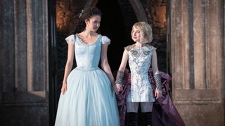 Agatha and Sophie hold hands as they smile at each other in The School for Good and Evil