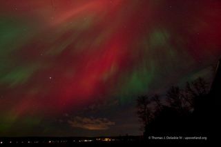 Astrophotographer Tom Dolaskie IV caught the aurora over Munising, Michigan on October 24, 2011.