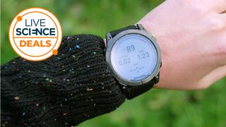 A Live Science Deals logo and a picture of our reviewer testing the Garmin Enduro 2