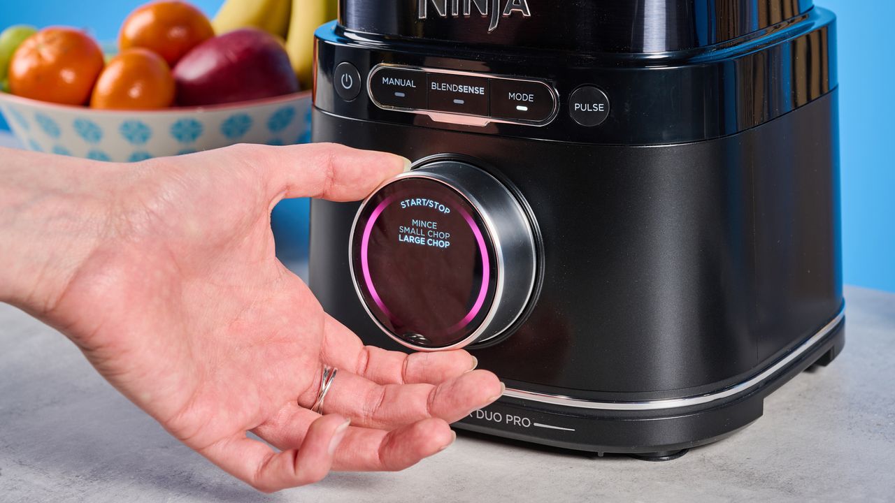the ninja detect power pro with blendsense, a powerful blender with removable blades, a personal blender attachment, and control dial photographed against a blue background