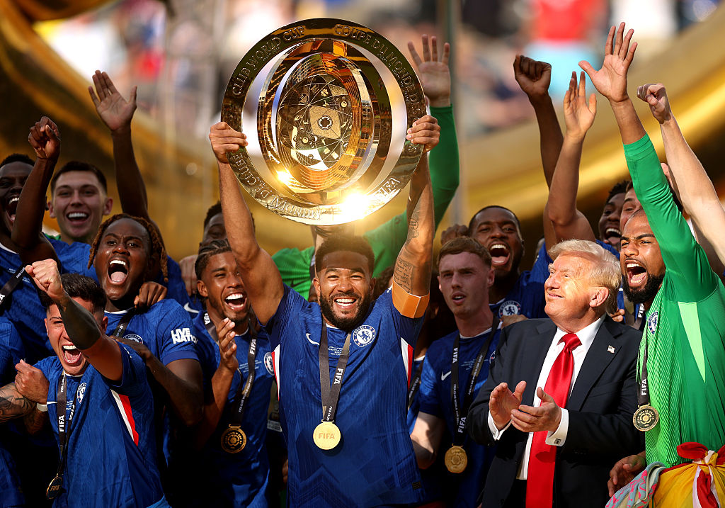 Reece James of Chelsea FC lifts the FIFA Club World Cup trophy as US President Donald Trump reacts following the FIFA Club World Cup 2025 Final match between Chelsea FC and Paris Saint-Germain