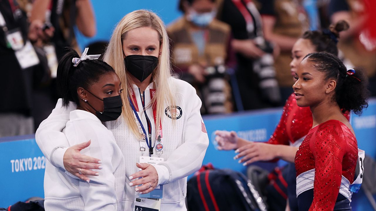 tokyo, japan july 27 simone biles of team united states is embraced by coach cecile landi during the women&#039;s team final on day four of the tokyo 2020 olympic games at ariake gymnastics centre on july 27, 2021 in tokyo, japan photo by ezra shawgetty images