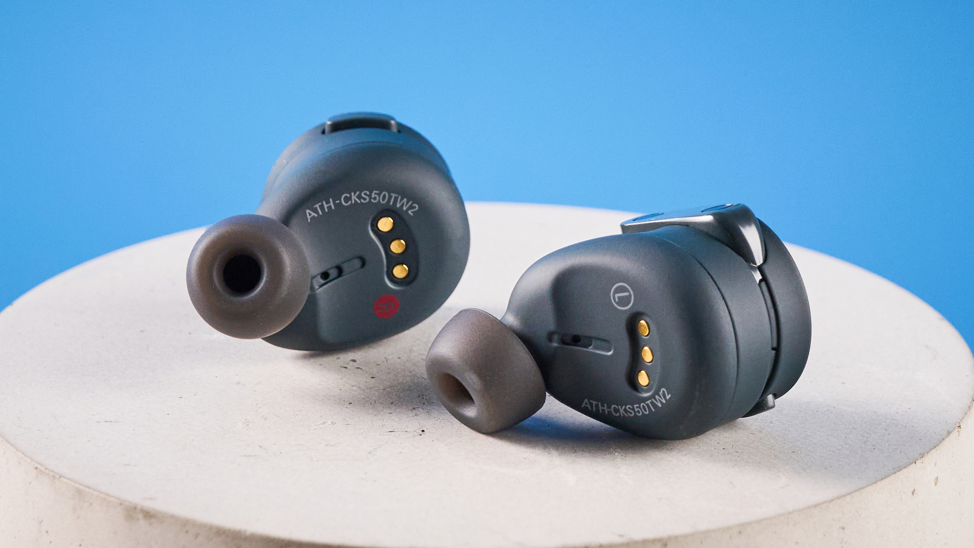 Audio-Technica ATH-CKS50TW2 in black colorway photographed ona blue background