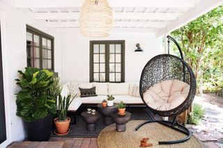 A backyard seating area with swing chair