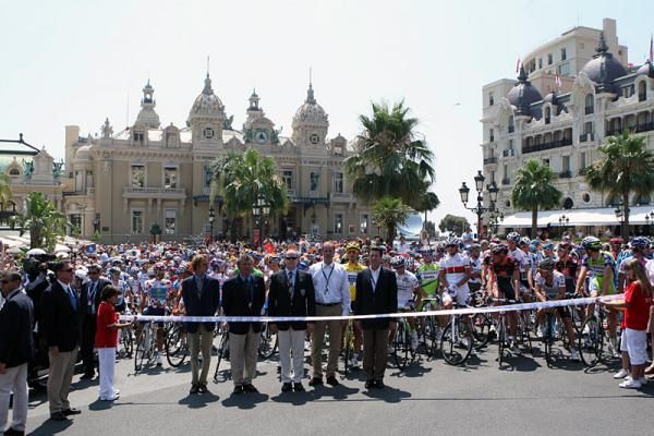 Tour dignitaries and the peloton at the start line in Monaco.